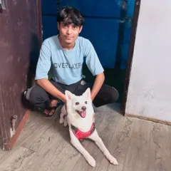 Another member of our team sharing a happy moment with Bunni. Every person here is a dedicated dog lover, committed to making every pup feel at home.