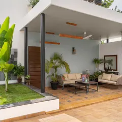 We transformed this terrace into a serene outdoor lounge. The design provides a covered seating area for relaxation, surrounded by lush greenery, creating a perfect escape with views of the Bangalore skyline.