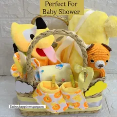 Perfect for a baby shower, this unisex gift basket is overflowing with yellow-themed goodies, including multiple soft toys and clothing essentials for the newborn.