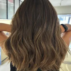Summer beach blonde highlights on a one-length textured lob. I added invisible layers to create movement without sacrificing the clean line of the cut.