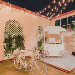 The magic is in the details that tell your story. For a Parisian-themed cocktail night, we created a charming Ladurée pop-up, complete with a floral bicycle, offering guests a sweet, unexpected escape.