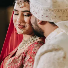 An intimate and emotional close-up of the groom whispering to his bride. This photo captures a tender, unscripted moment that speaks volumes about their love.