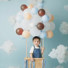 This hot air balloon theme for my son Caden's 8-month milestone was so much fun to create. I love designing unique, playful studio setups for baby photoshoots that capture their budding personalities.