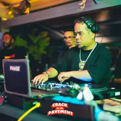 In the zone at a live gig. Being a professional DJ isn't just about playing music; it's about reading the room and controlling the energy. I bring years of real-world club experience to every lesson I teach.