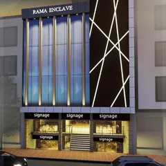 A nighttime render of the "Rama Enclave" commercial complex. The facade design uses vertical lighting elements and a dynamic crisscross pattern of lights to create a memorable and modern look that stands out.