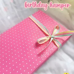 The "lil girl edition" birthday hamper, all wrapped up in a cute pink polka dot box with a rainbow ribbon. The surprise starts from the outside.