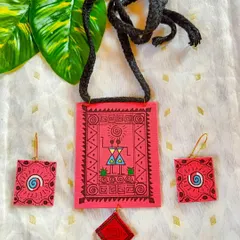 This set celebrates the simplicity and charm of Warli folk art. I hand-paint the traditional motifs, depicting scenes of tribal life, onto a bright pink fabric base. The necklace and matching earrings are incredibly light and tell a story of community and culture.