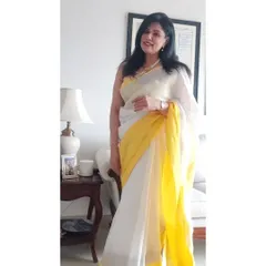 There's nothing like the feel of a light linen saree on a warm day. For a lunch out with my favourites, I wore this white and yellow linen saree with my mother's classic pearls. It’s a perfect example of effortless elegance that doesn't compromise on comfort.