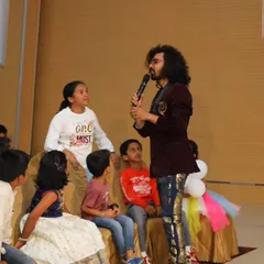 An interactive magic session where I bring the kids up close to the action. I believe the best magic happens when the audience is part of the trick, creating a truly memorable and engaging show for children.