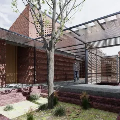 An interior courtyard at Studio Tarai. The design interweaves solid brick volumes with open, naturally lit courts and covered walkways. A tree grows through the center, emphasizing the integration of landscape within the building's footprint.