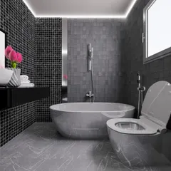A bold bathroom design in shades of grey and black, featuring mosaic tiles, a freestanding bathtub, and modern fixtures for a dramatic look.