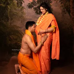 A pose of reverence and love from our Ram Sita series. The father-to-be kneels to kiss the baby bump, a beautiful gesture of anticipation and blessing for their child.