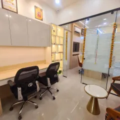 The workspace for my team. This is the workstation area in my new office. It's designed to be bright and organized, with an illuminated shelf displaying various healing crystals and pyramids that keep the office energy positive and productive.