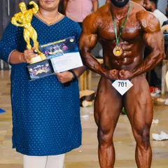 Posing with my wife and my trophy after winning Mr. Karnataka 2024. These are the moments that make all the sacrifice and hard work worth it.
