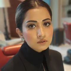 We created this sophisticated look featuring a soft brown smokey eye and a perfectly sculpted complexion. The hair is styled into a sleek, low bun, ideal for a polished and professional appearance.
