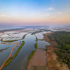 A hidden spot in Kumta, known only to locals. Beyond its famous beaches, the area where the Aghanashini river snakes through villages offers unique sights of salt making and marine activities.