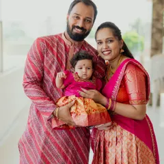 The first official family portrait. I love capturing the pride and happiness of new parents as they hold their baby on this significant day.