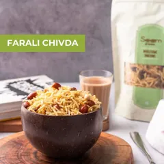 My Farali Chivda is a classic fasting snack. Served here in a coconut shell bowl with a glass of chai, it's a comforting and delicious treat for your upvaas days.