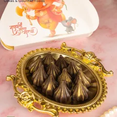 For a guilt-free celebration, I offer this box of 11 sugar-free chocolate modaks. They bring all the festive indulgence without compromise, making them a great choice for gifting or prasad.