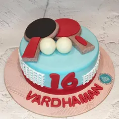 Game, set, match! This table tennis themed cake was made for a 16th birthday. It features edible paddles and balls on a light blue 'table' with a net around the side.