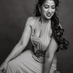 A joyful and candid moment captured in timeless black and white. Pallavi's smile and the movement in her hair give this portrait a feeling of life and energy. It’s a celebration of her spirit, rendered in classic monochrome.