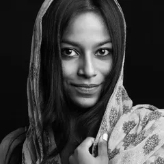 A captivating black and white portrait of a dusky model. I focus on creating powerful images that celebrate diverse beauty.