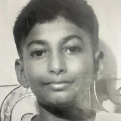 This is the original photograph the student used as a reference for his self portrait. We teach our students how to translate a photo into a hand drawn piece of art.
