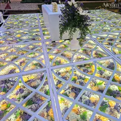 Another perspective of the stunning floral-filled glass floor, showcasing the intricate lattice design and the vibrant colors of the flowers beneath.