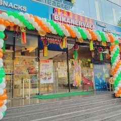 This is one of several angles of the Republic Day balloon arch decoration at Bikanervala. The full arch creates an inviting and patriotic entrance for the restaurant's customers.