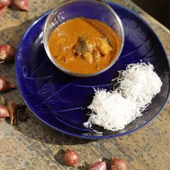 Our Ulli Theeyal features caramelized roasted coconut, tamarind, and slow-cooked shallots. With its deep, smoky flavours and crackling tanginess, this dense and intriguing dish is a bold, complex experience.