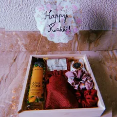 Make your sister feel cherished with a custom Rakhi hamper. This thoughtful gift set in a wooden tray includes a beautiful watch, scrunchies, and skincare items from The Body Shop, all chosen to make her feel pampered and loved.