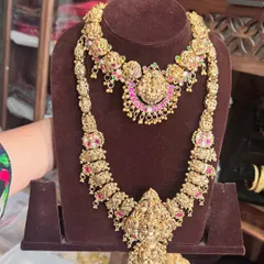 Just look at the incredible detail on this antique gold replica bridal set. The layered harams feature goddess motifs, giving you that authentic, royal South Indian bride look that I absolutely adore.