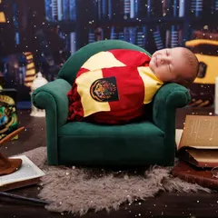 Even wizards need a nap! This sleeping baby, dressed in a Gryffindor scarf, looks so peaceful in our magical Hogwarts library setup, complete with floating candles and books.