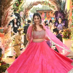A vibrant shot from a wedding event in a stunning pink lehenga. This is a great example of high-quality event and ethnic wear content that resonates with my audience.