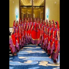 For group performances, I offer matching sets of traditional dance costumes like these vibrant red Ghoomar dresses. Each outfit is designed for visual impact and comfort, making your team's performance unforgettable.