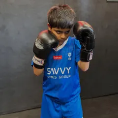 The fighting stance of a future champion. Even our youngest students learn proper form and technique from day one. This focus on fundamentals is key to their success.