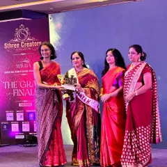 Here I am on stage accepting my award. I share this achievement with every woman entrepreneur who dares to dream and build something from the ground up.