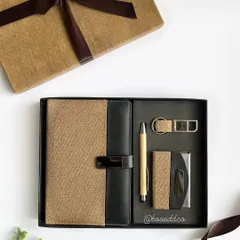 A classy corporate gift set featuring a diary with a jute and leather-finish cover, a bamboo pen, and a matching card holder and keychain. This set can be fully customized with a company's logo.
