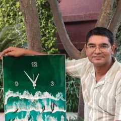 I am proudly posing with a large, rectangular ocean-themed clock. This piece combines the beauty of ocean waves with the functionality of a timepiece.