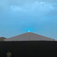 Another color variation of the sunset scene, with the sky edited to a solid blue, highlighting the shape of the sun.