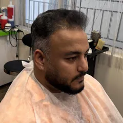 The "before" shot, showing the client's natural dark hair before we began the transformation to silver.