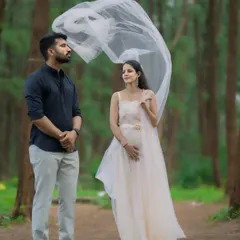 A lovely couple's shot featuring the white net trail gown. It's a timeless and classic choice for a pre-wedding shoot with a soft and romantic vibe.