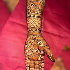 This stunning ring ceremony design is filled with beloved traditional symbols. I combined floral patterns with peacock and elephant motifs to create a rich, celebratory look perfect for an engagement.