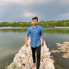 The cloudy sky adds a dramatic touch to the peaceful lake scenery.