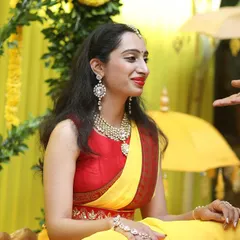 The bride during her Haldi ceremony, surrounded by a custom-designed yellow decor theme that perfectly complements the traditional rituals.