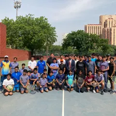 Our players and coaching staff united on the court. This group photo captures the energy of our academy and the collaborative spirit between our experienced coaches and aspiring young athletes, all dedicated to the journey of tennis excellence.