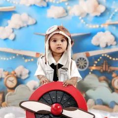 Let your child's dreams take flight with our adorable pilot-themed photoshoot. This setup includes a custom-built propeller plane, fluffy clouds, and a vintage aviator hat for a picture-perfect adventure in the skies.