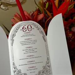 Every great meal starts with a promise. This beautifully designed menu for a 60th birthday celebration outlines the six-course culinary journey we crafted for the special occasion.