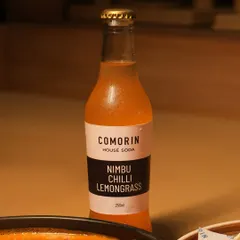 Our house-made Nimbu Chilli Lemongrass soda is the perfect drink to cut through the heat of a spicy curry. Its bright, citrusy flavor with a hint of chili keeps you going for one more bite.