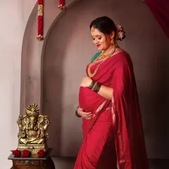 A quiet moment of connection. This beautiful mama-to-be gazes lovingly at her bump, her traditional attire adding a layer of grace and heritage to the portrait.